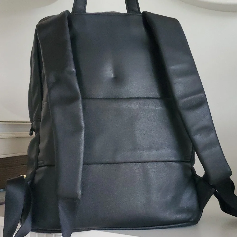 Tumi Voyageur Halle Black Leather Backpack with Gold Hardware